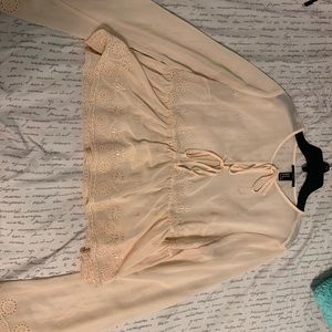 A peachy nude crop top